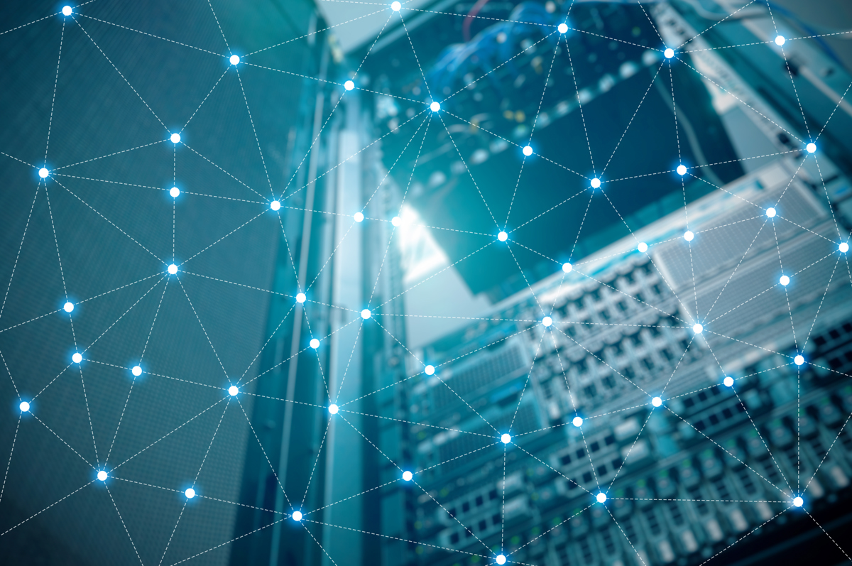 IT servers in the background with a glowing network of dots in the foreground represents a converged enterprise wireless network design.